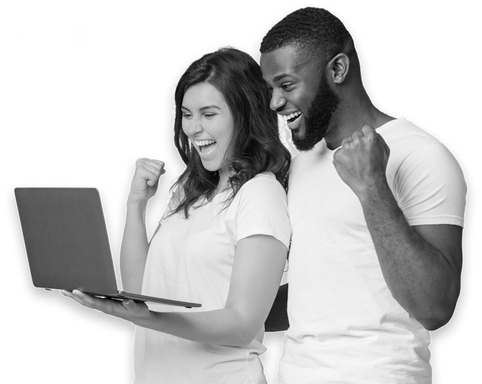 Team celebrating results in front of a laptop
